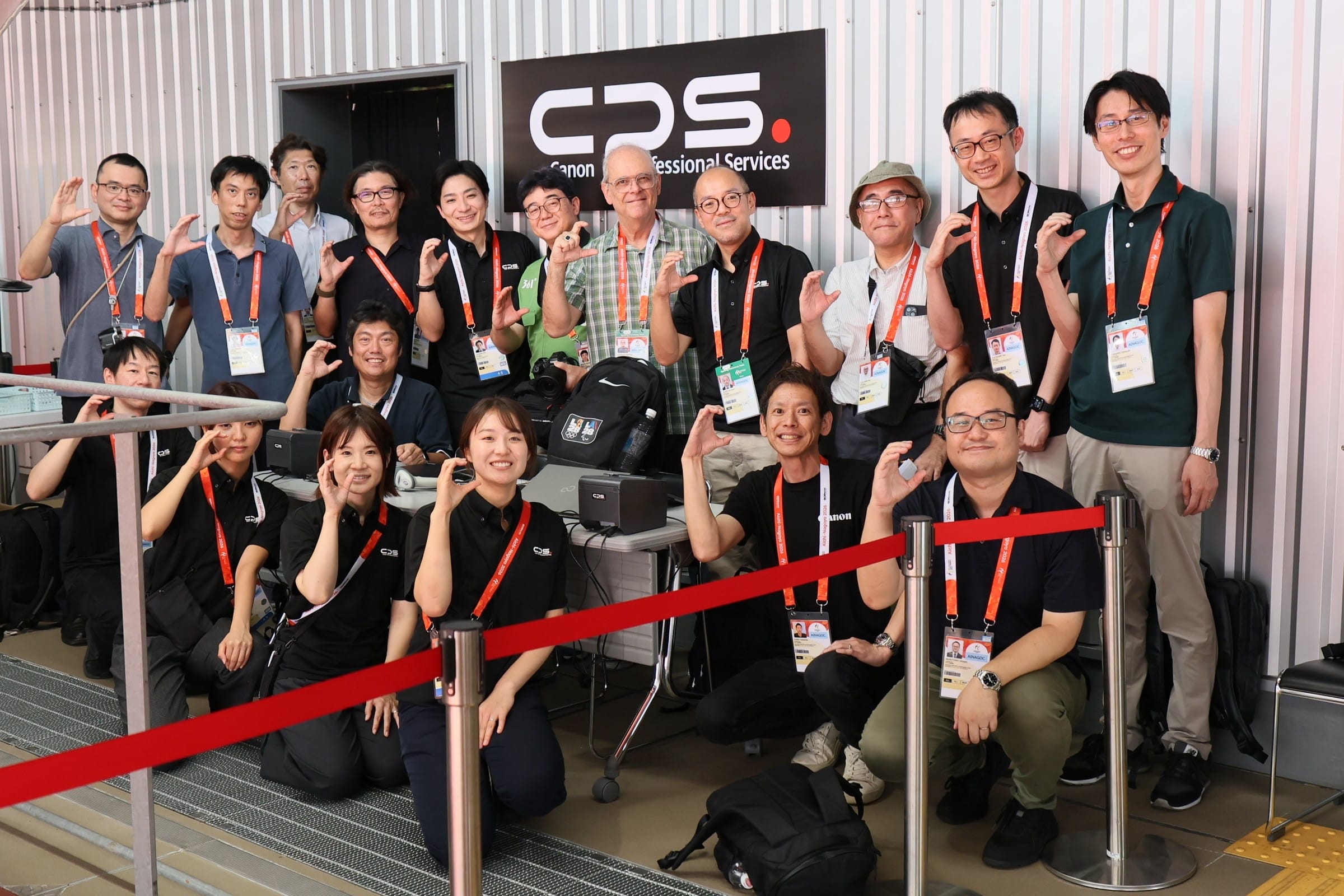 Canon’s remote photography team in front of the CPS sign