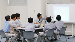 Image of a meeting at Oita Canon Materials