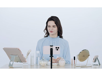 Conceptual image of one-person livestream using multiple iPhones and iPads