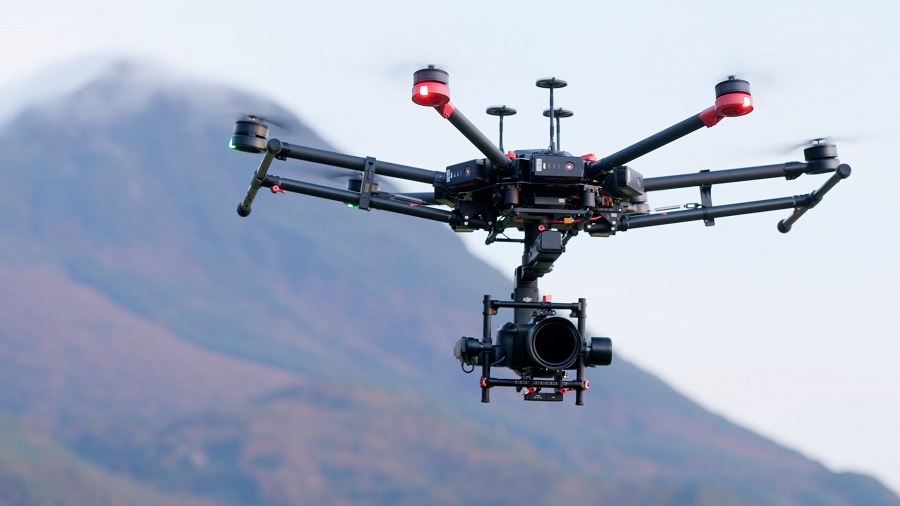 Image of aerial filming using a drone-mounted camera from a bird’s-eye view