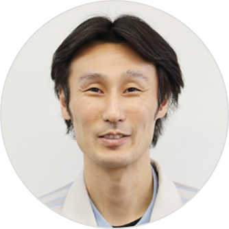 This is a portrait image of developer Takeshi Kawaguchi.