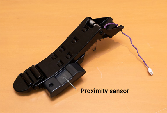 Illustration of the proximity sensor unit used for paper detection.