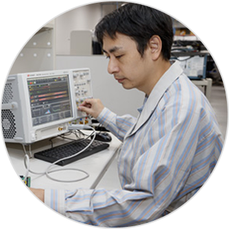 Portrait of a Canon engineer working on mechanical design and functionality.