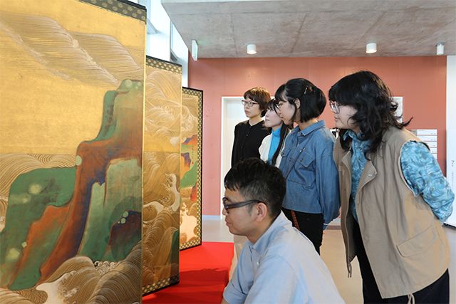 Students viewing the donated work